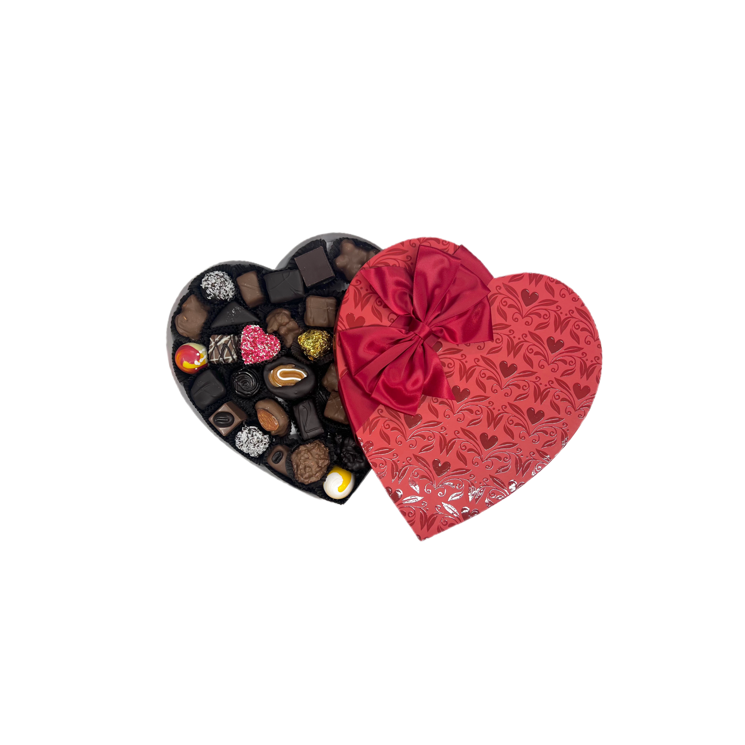 Heart-shaped chocolate box with a red lid featuring a bow, filled with assorted chocolates on a white background.
