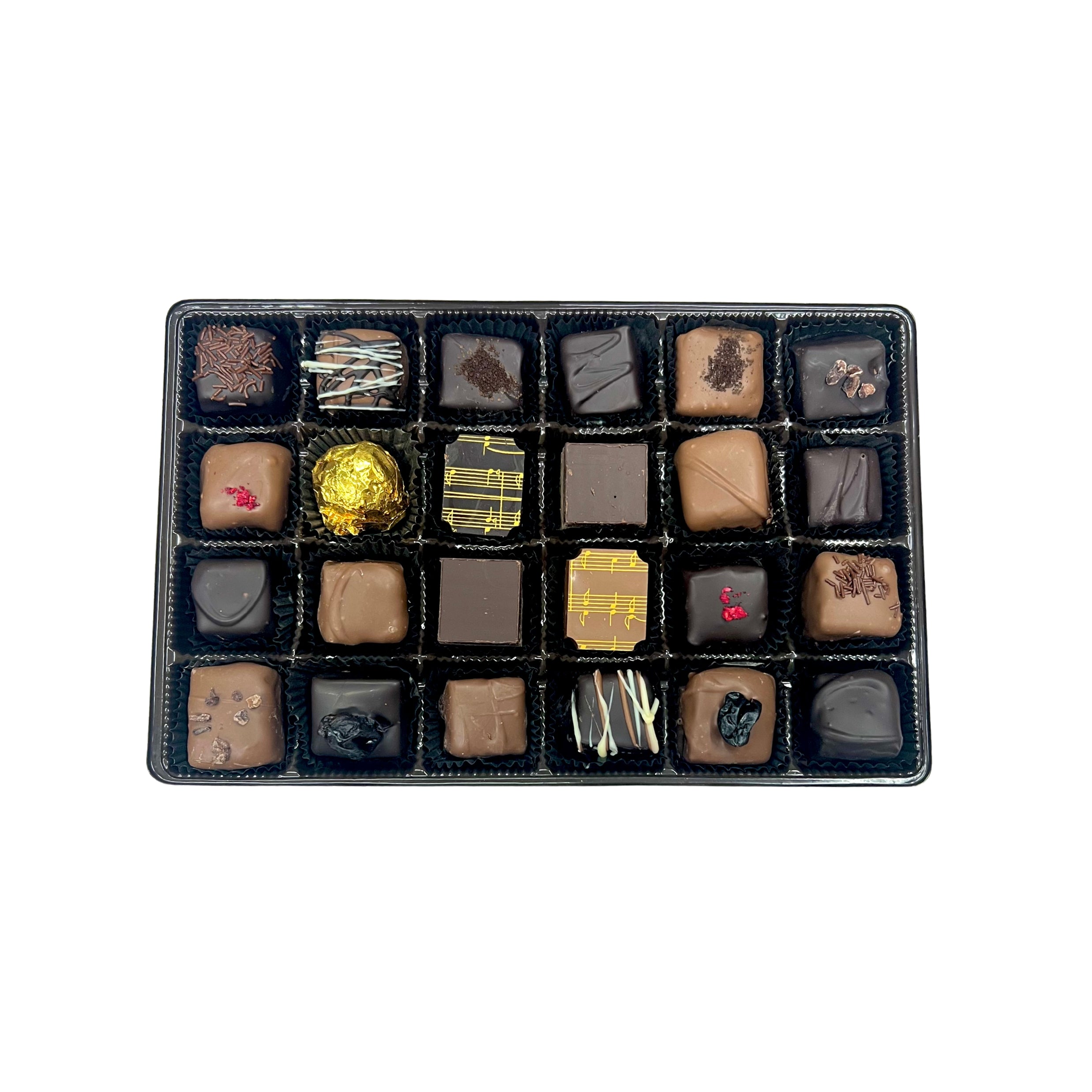 Assorted chocolates in a black box on a white background