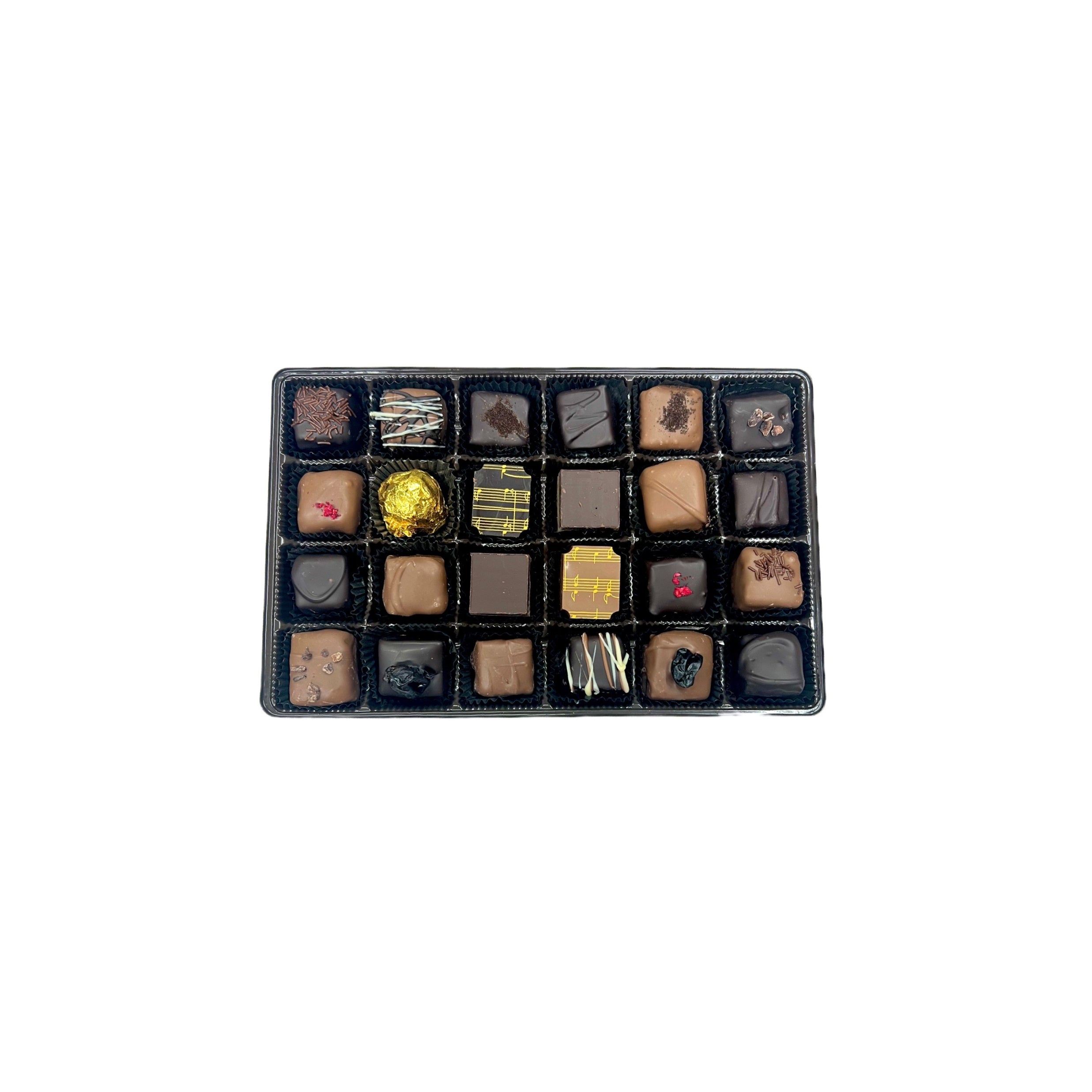 Assorted chocolate truffles in a black box on a white background