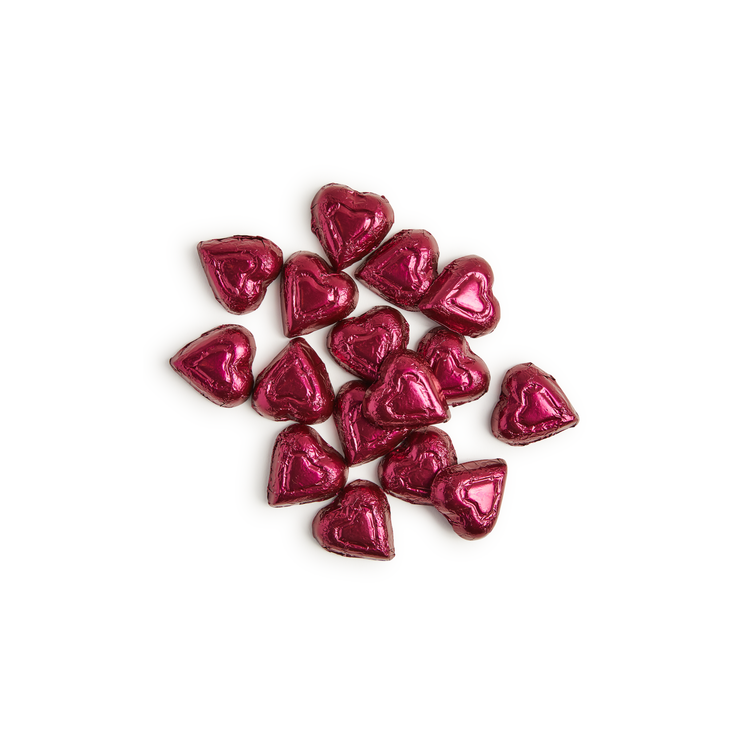 Pink heart-shaped chocolates on a white background