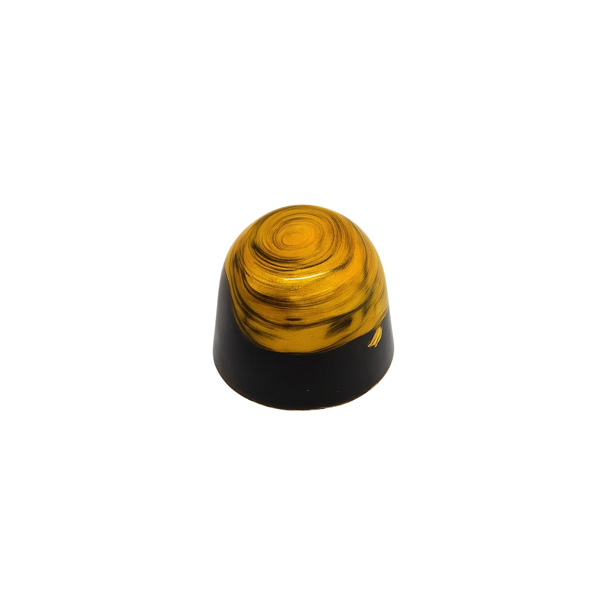 Yellow and gold dome shaped molded chocolate on a white background
