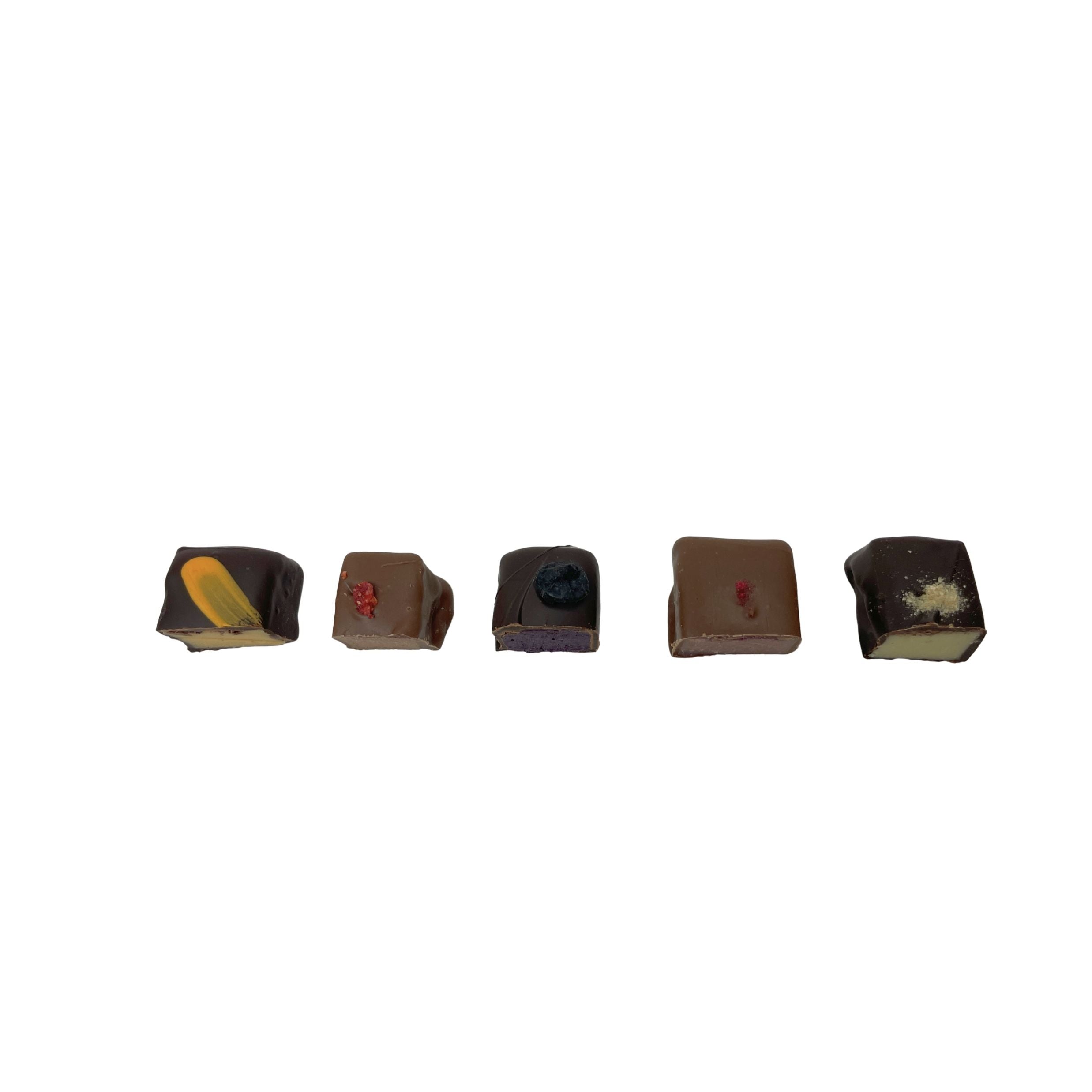 Five small artisanal chocolate pieces with various fillings and decorations, arranged in a horizontal row on a plain white background.