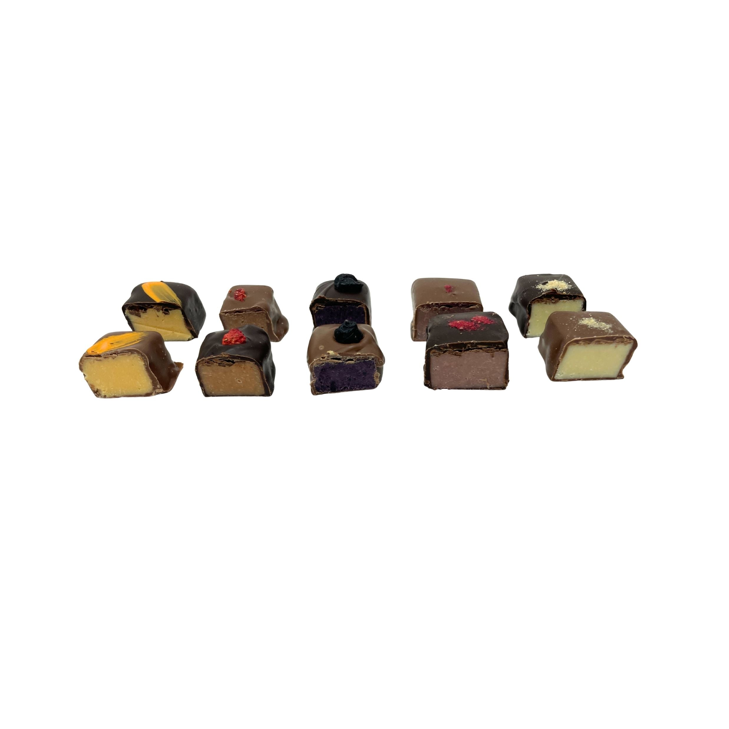A row of assorted miniature chocolate figurines shaped like real chocolates, displayed on a plain white background.