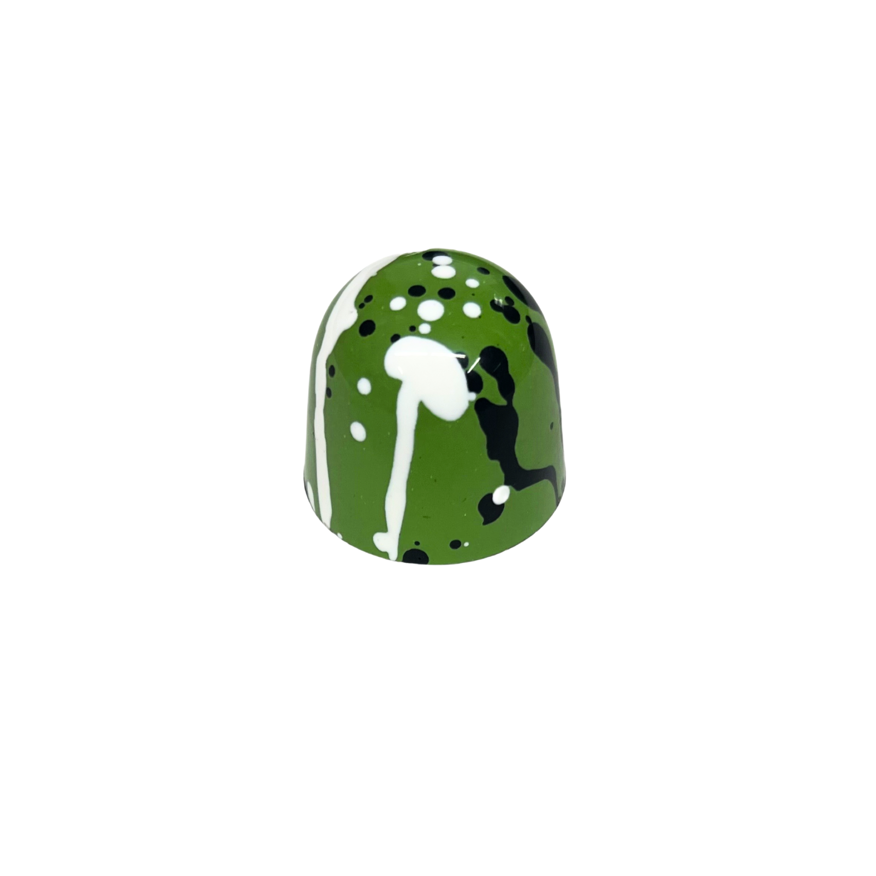 dome shaped bonbons with green, black and white bonbons