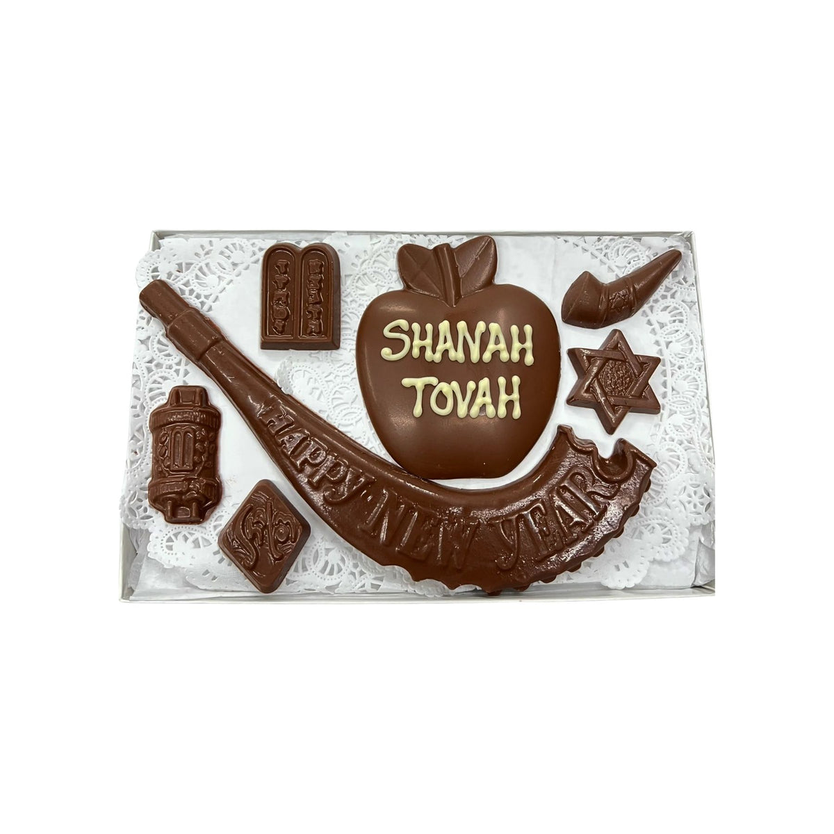 Chocolate shapes with SHANAH TOVAH writing on a white background