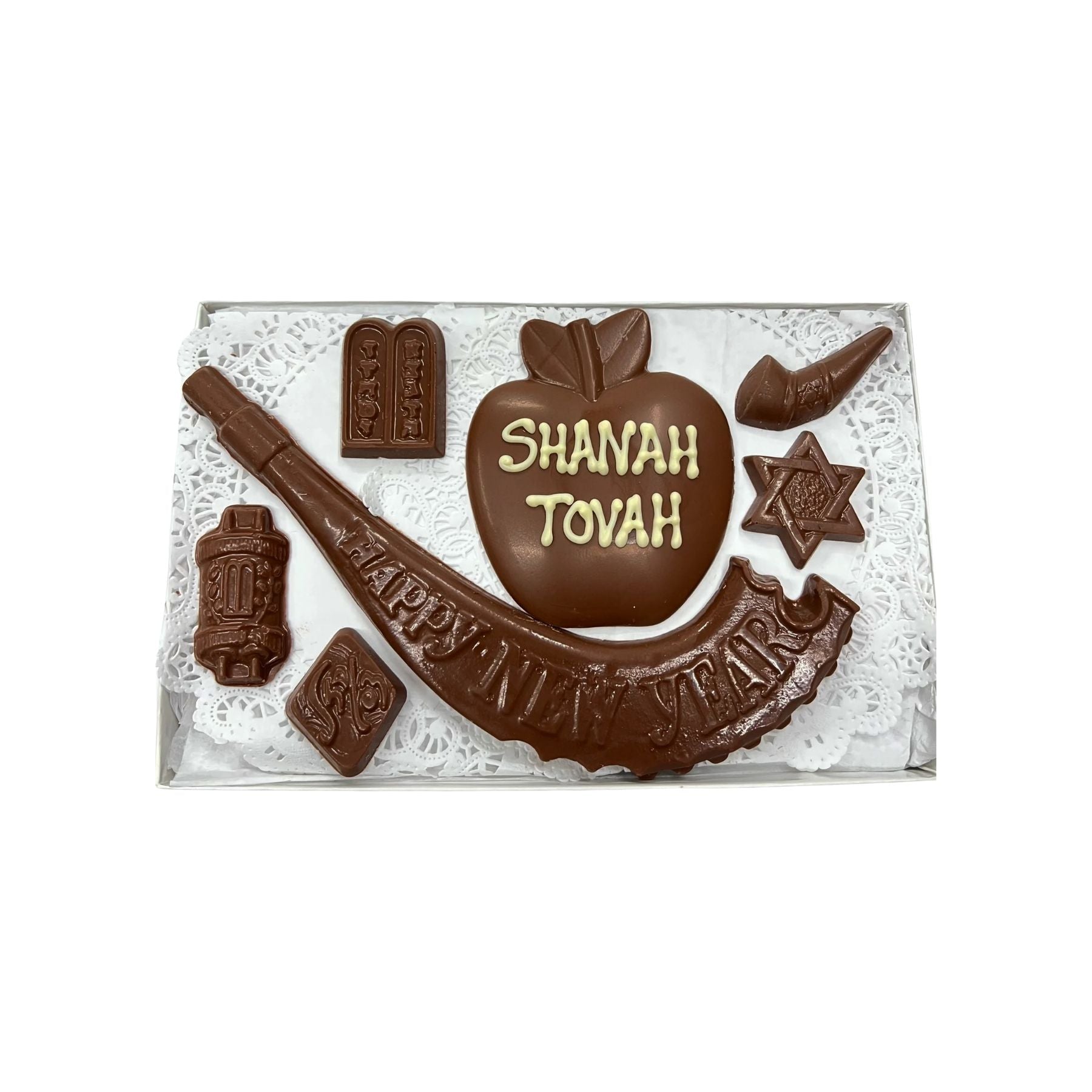 Chocolate shapes with SHANAH TOVAH writing on a white background