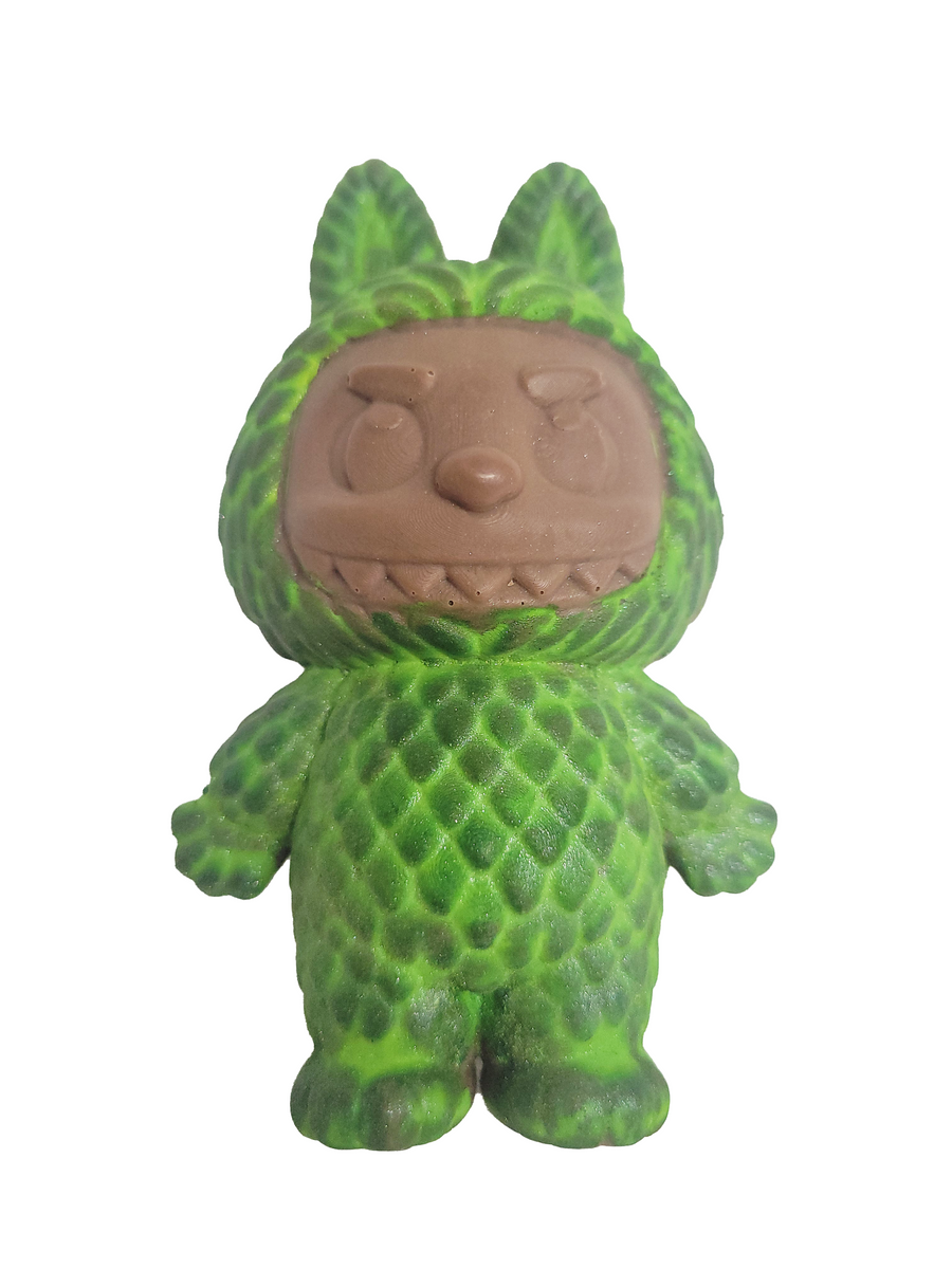 Green textured chocolate figure with 0n a white background