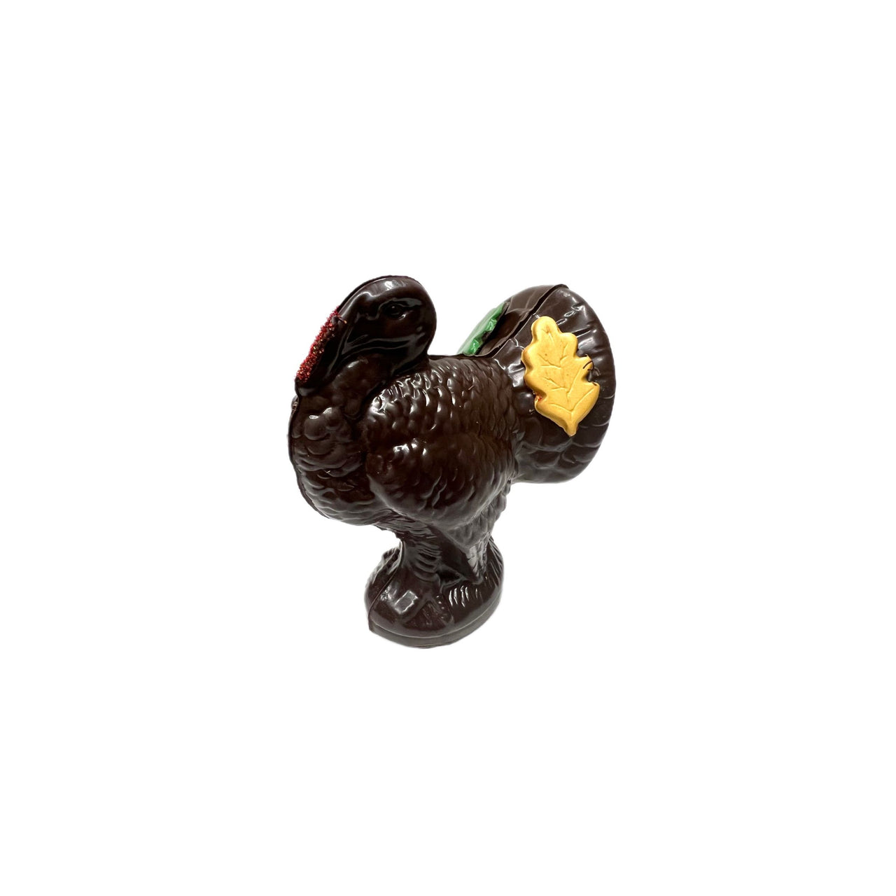 chocolate turkey with a yellow leaf against a white background