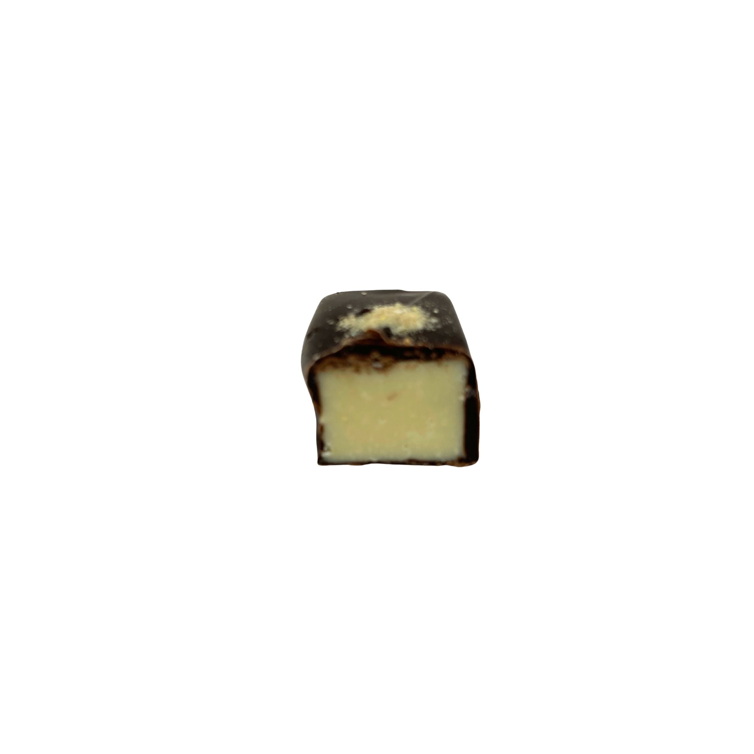 dark chocolate square with a lemon filling and off white speckle on a white background