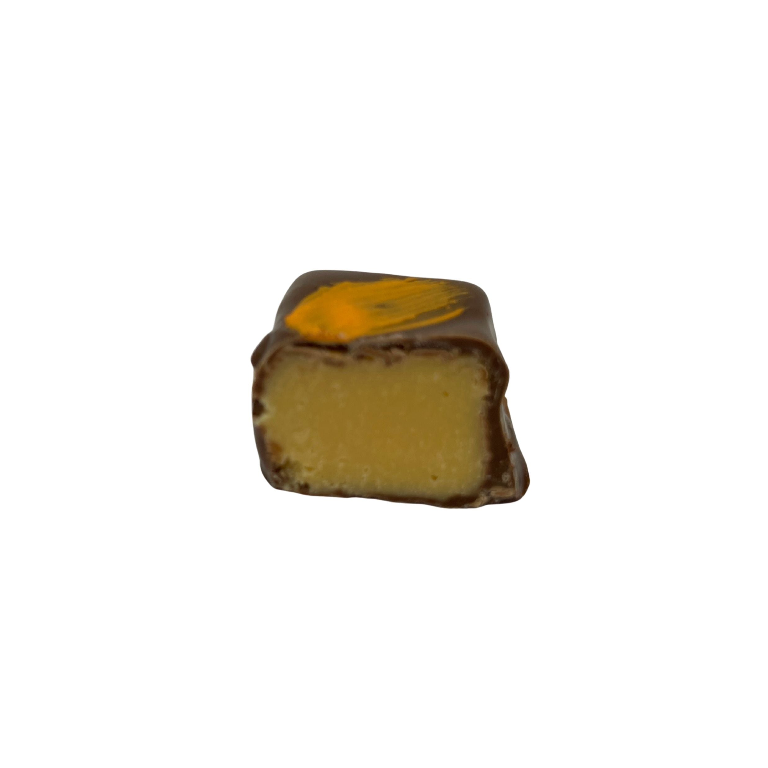 A single square chocolate candy with a golden-yellow center and a glossy dark brown chocolate coating, isolated on a white background.