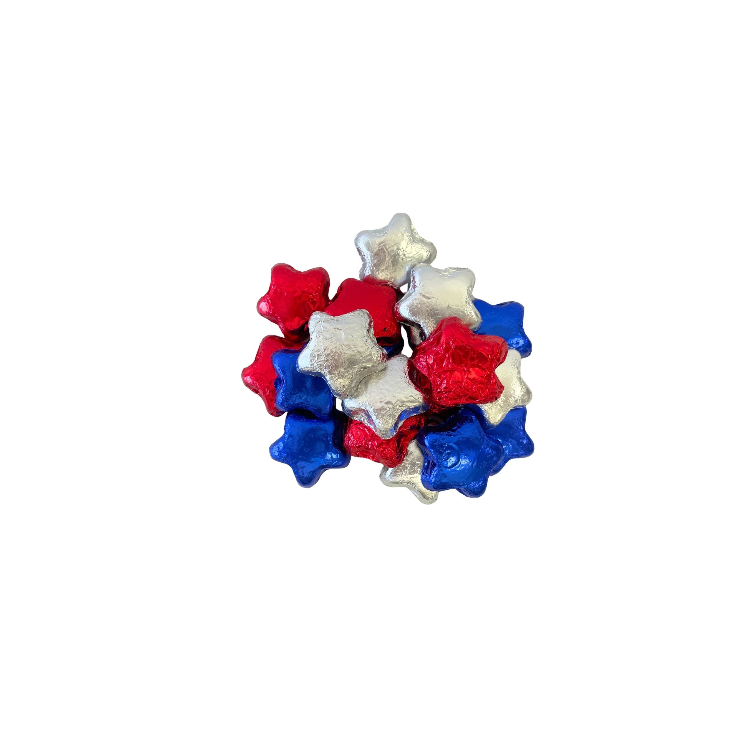 A small cluster of foil-wrapped star-shaped chocolates in red, white, and blue, photographed on a plain white background.