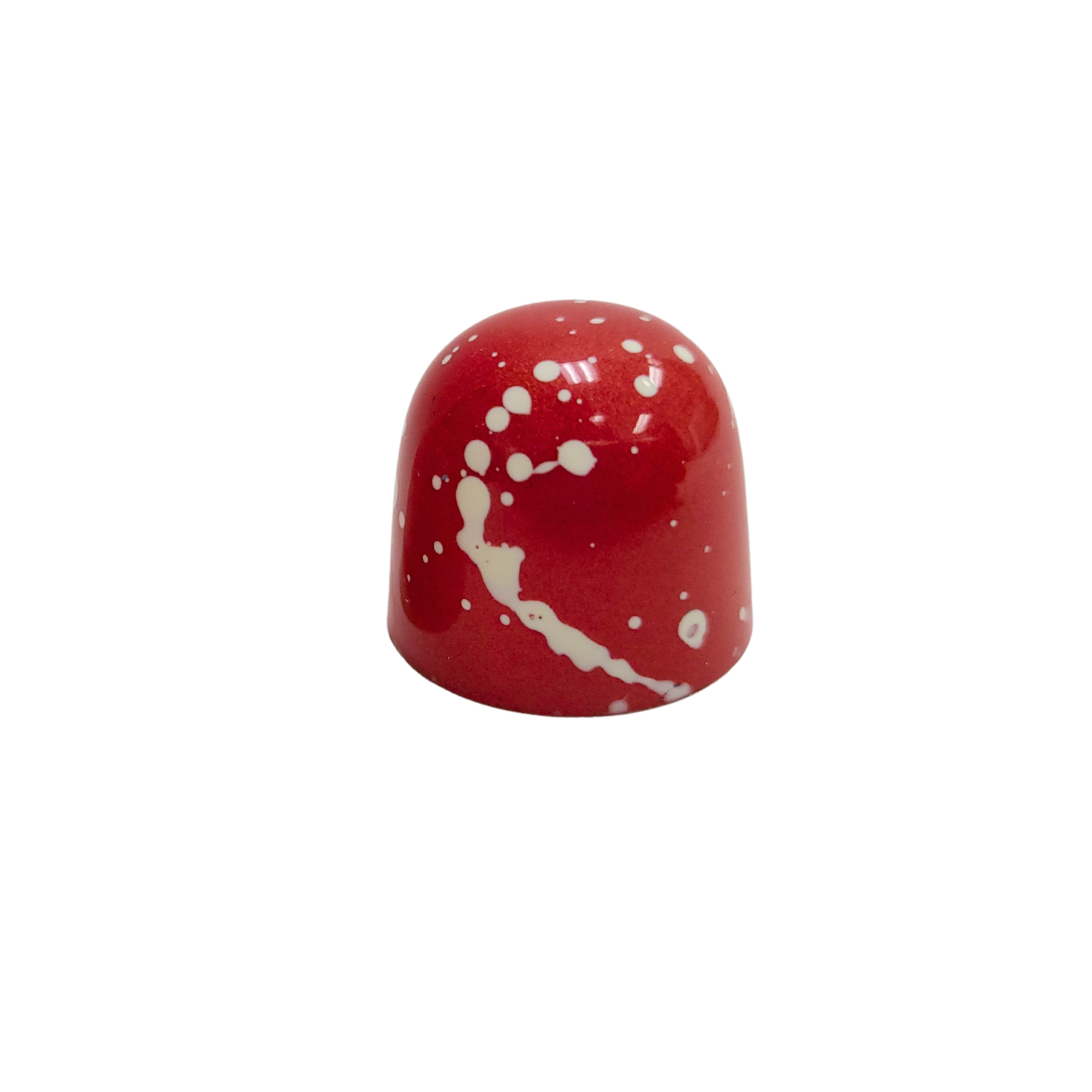 dome shaped bonbon with red and white cocoa butter