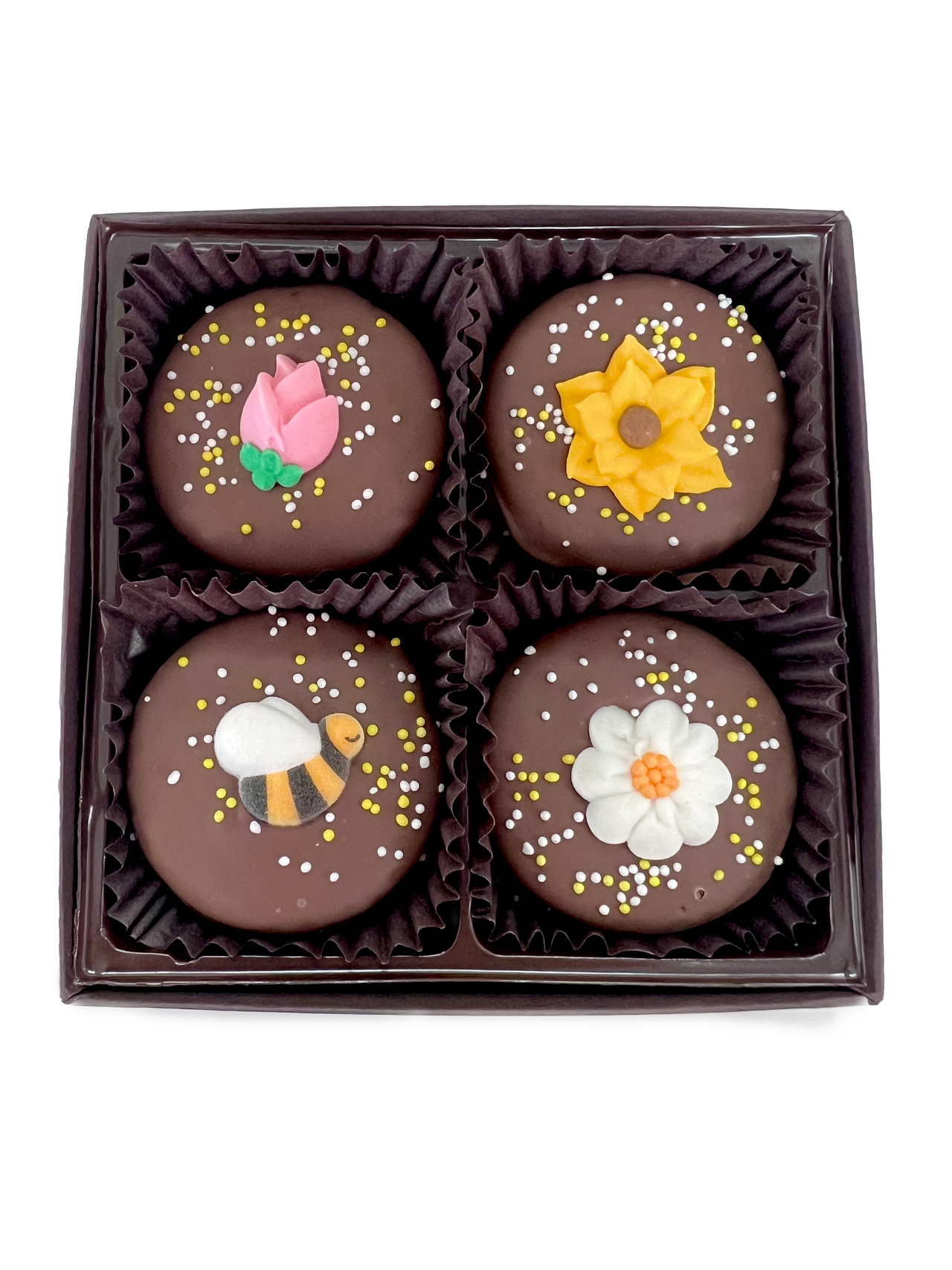 4 chocolate covered oreos with decorations