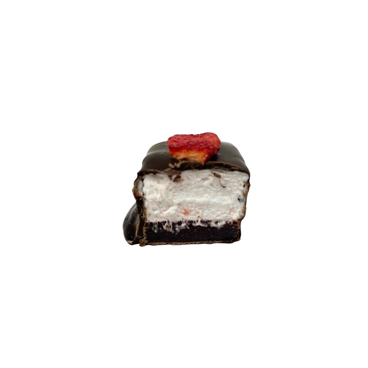 A piece of chocolate covered marshmallow, cut open with small strawberry on top, isolated on a white background.