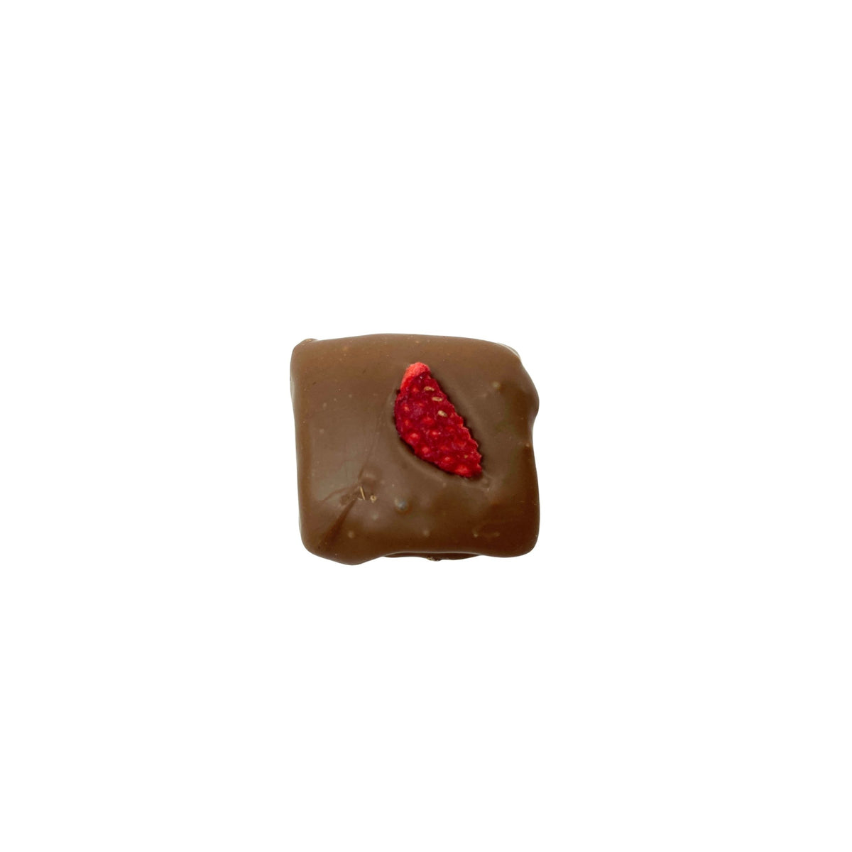 A single square piece of chocolate with a red strawberry slice on top, isolated on a solid white background.