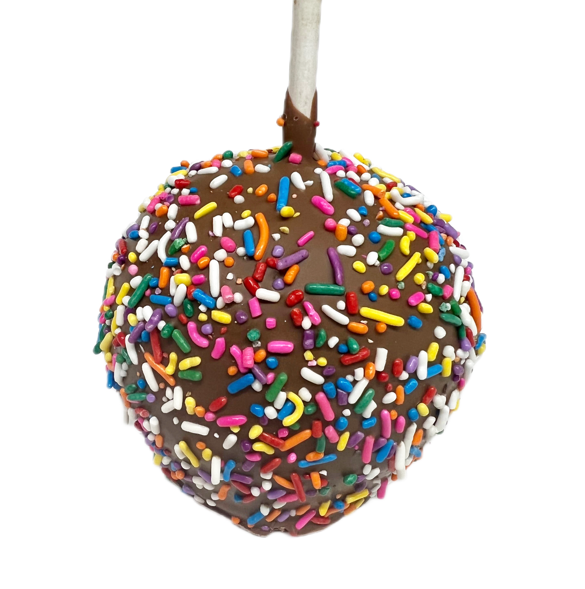 chocolate covered apple with rainbow sprinkles on a white background