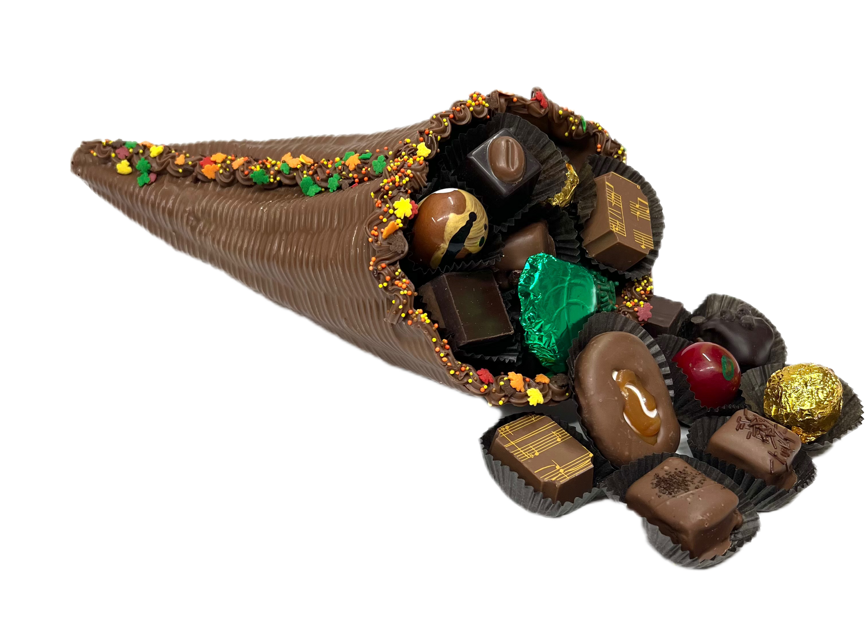 chocolate cornucopia with chocolates in brown cups and decorations