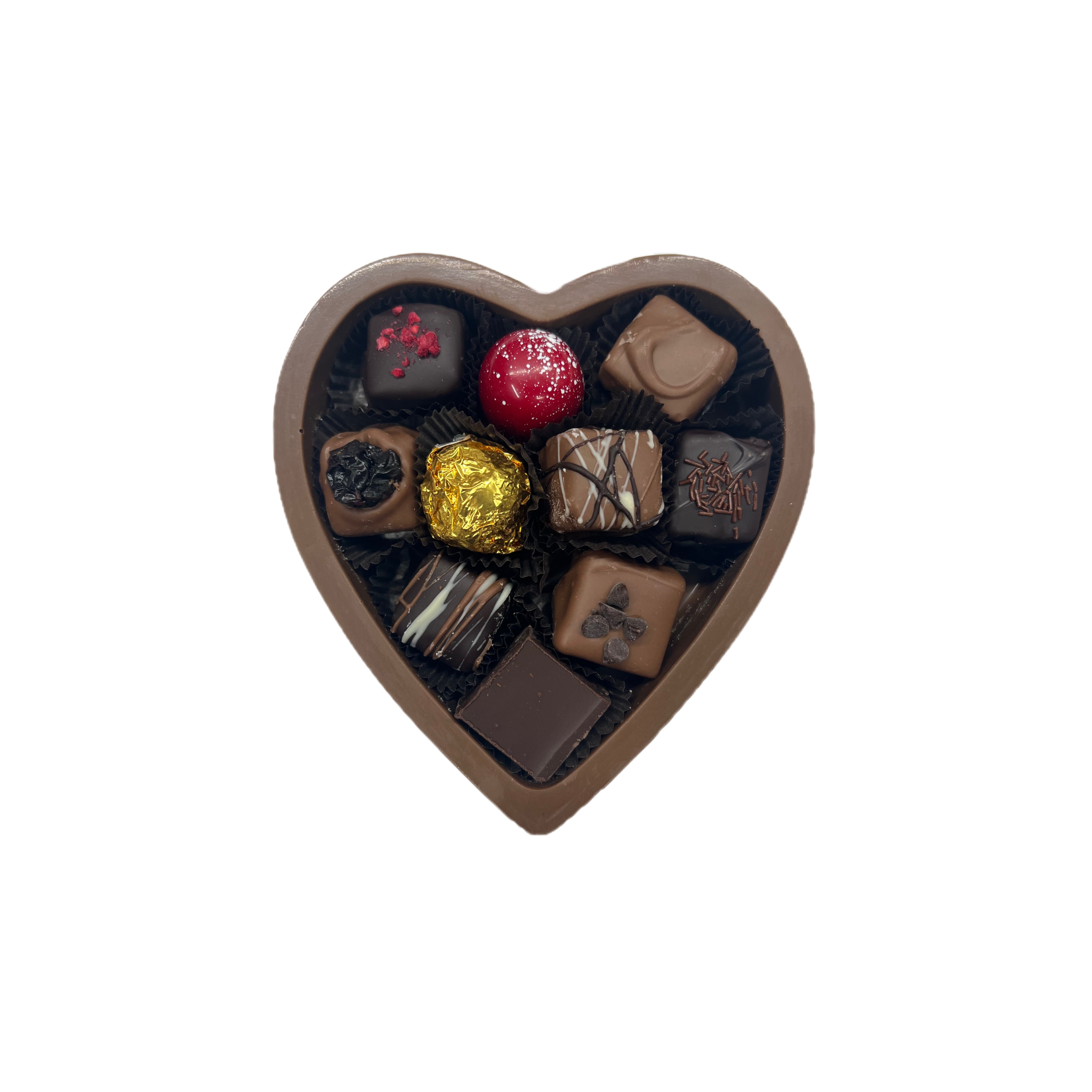 Heart-shaped box of assorted chocolates on a white background