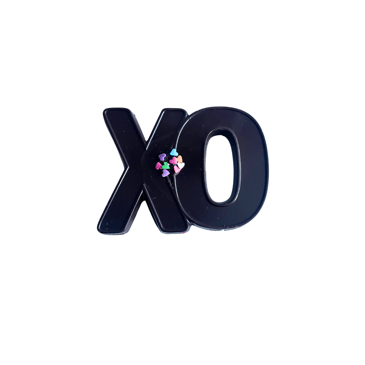 Black 'xo' letter with colorful hearts on a white background