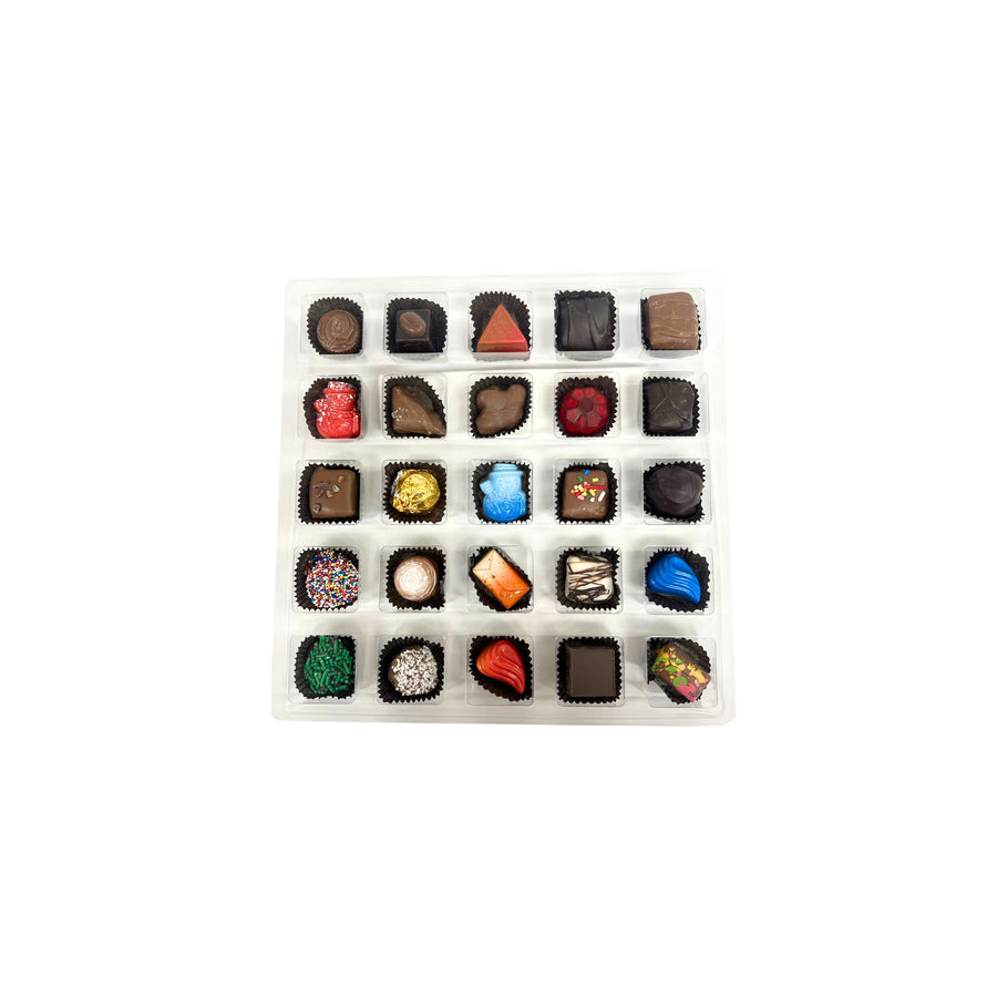 Assorted chocolates in a white box on a white background
