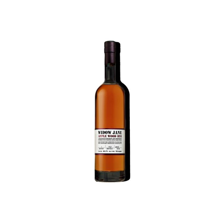 A bottle of Widow Jane Still Wood Spirit whiskey, featuring a dark amber liquid, a white label with black text, and a dark brown cap, set against a plain white background.