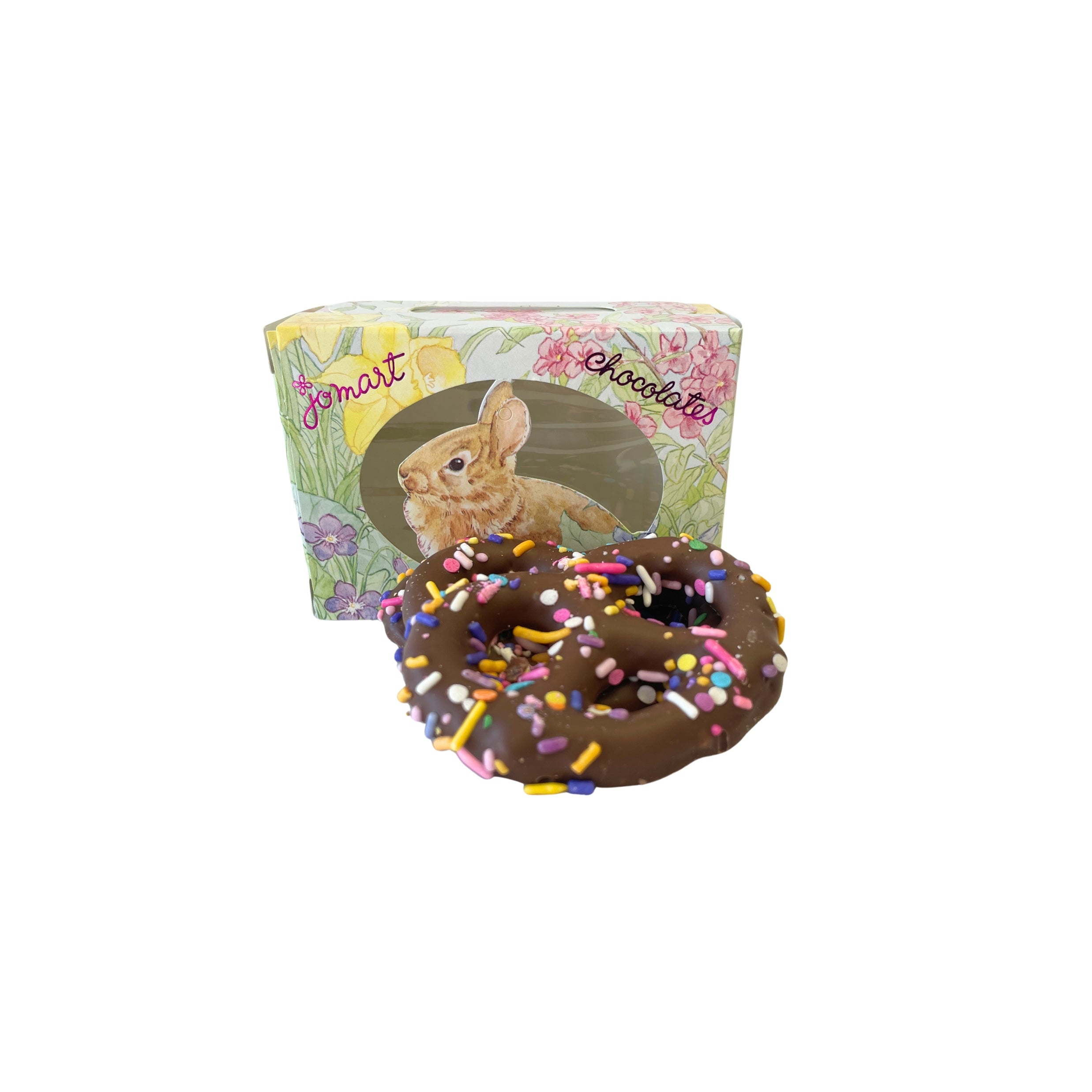 Chocolate pretzels with sprinkles in front of a JoMart packaging on a white background