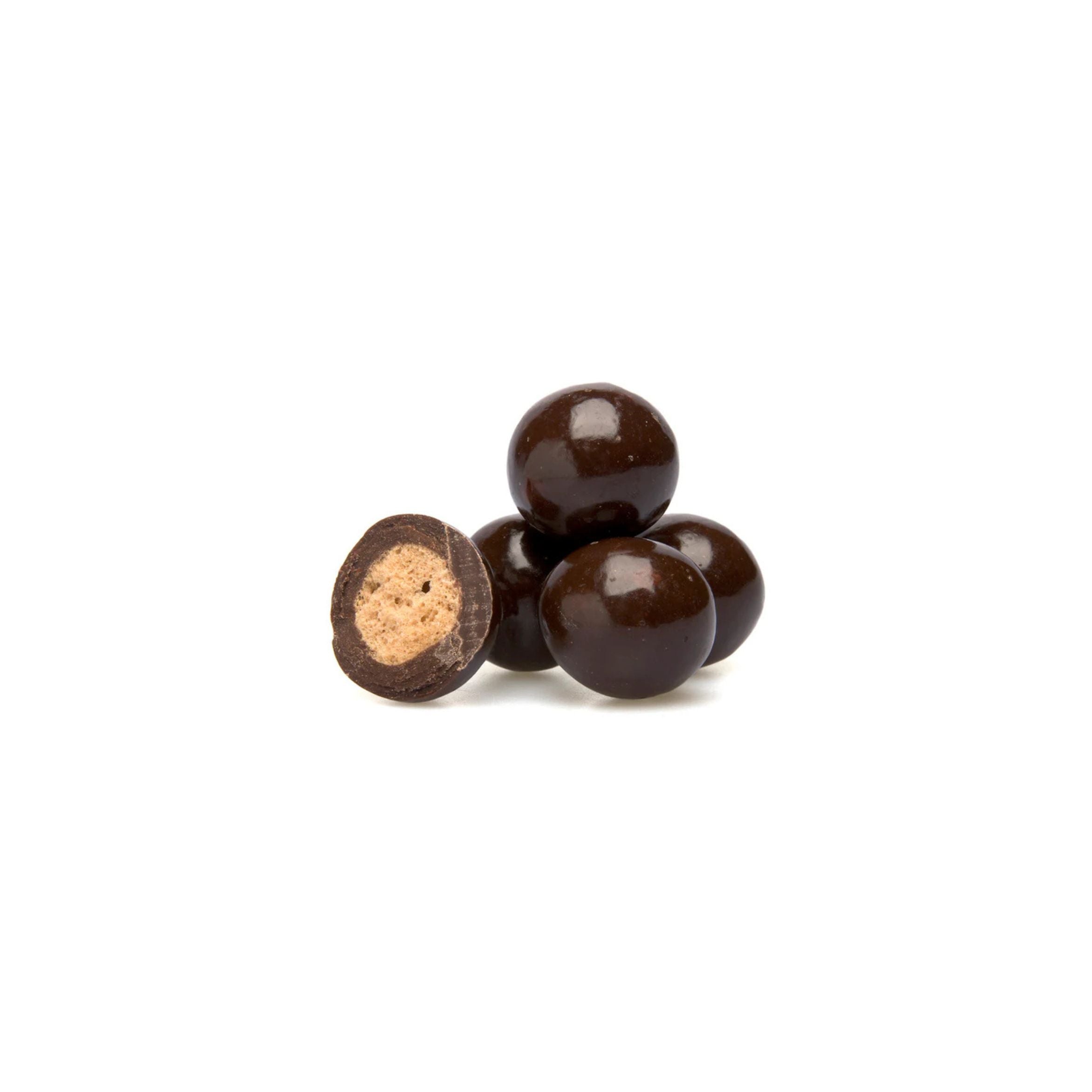 Chocolate-covered cookies with a crumbly center on a white background