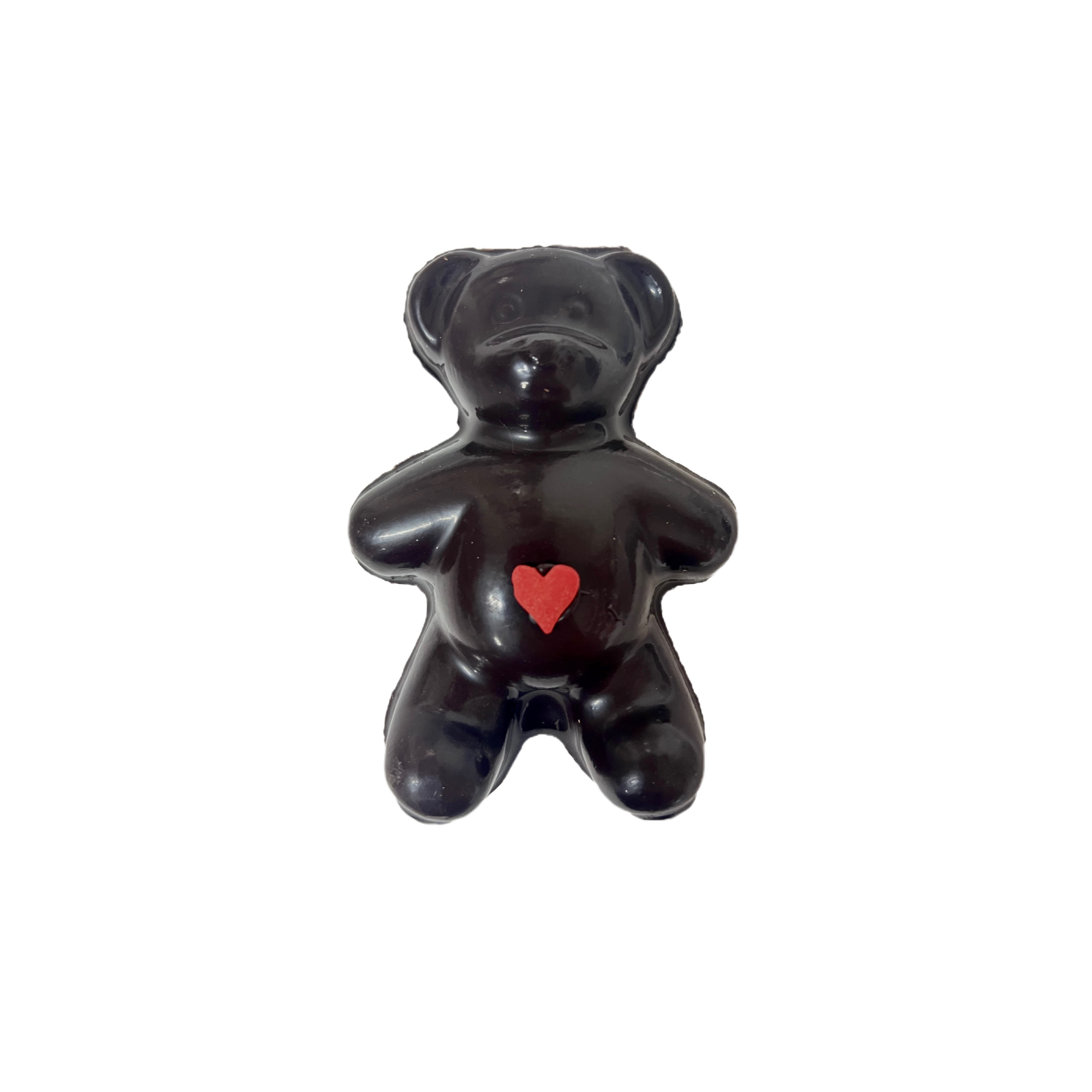Chocolate bear with a red heart on a white background