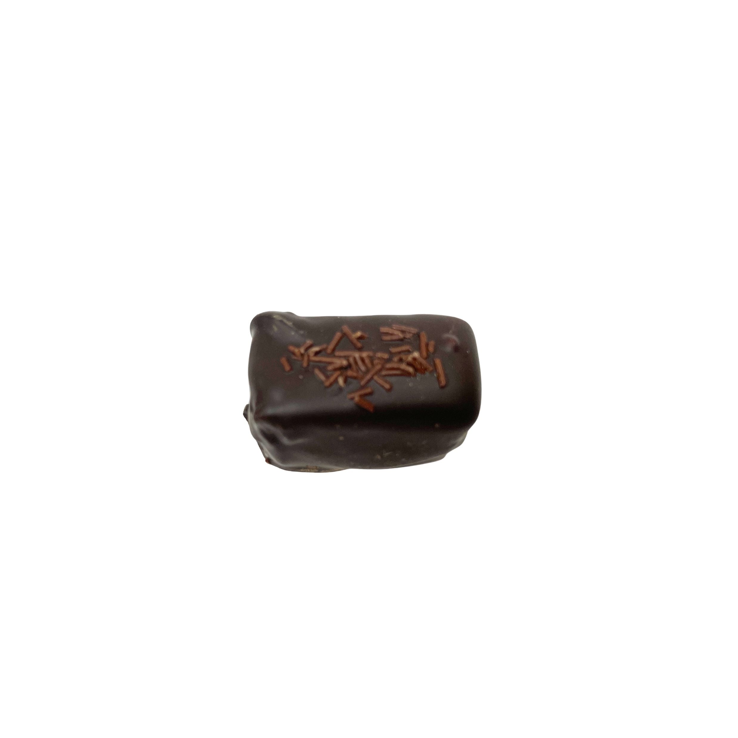 A single dark chocolate candy bar with decorative sprinkles on top, isolated on a solid white background.