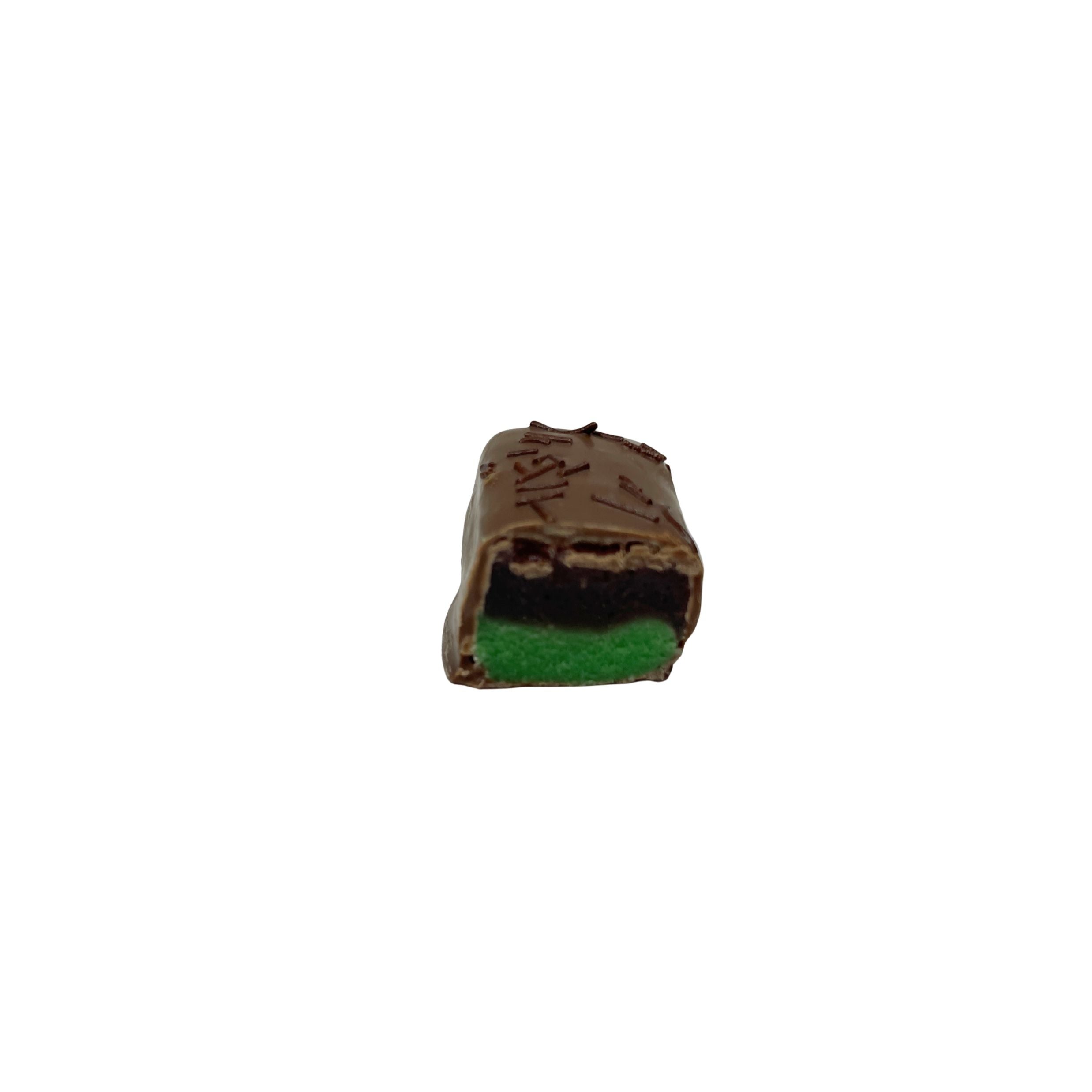 milk chocolate piece with a layer of green and dark maroon with chocolate sprinkles on a white background