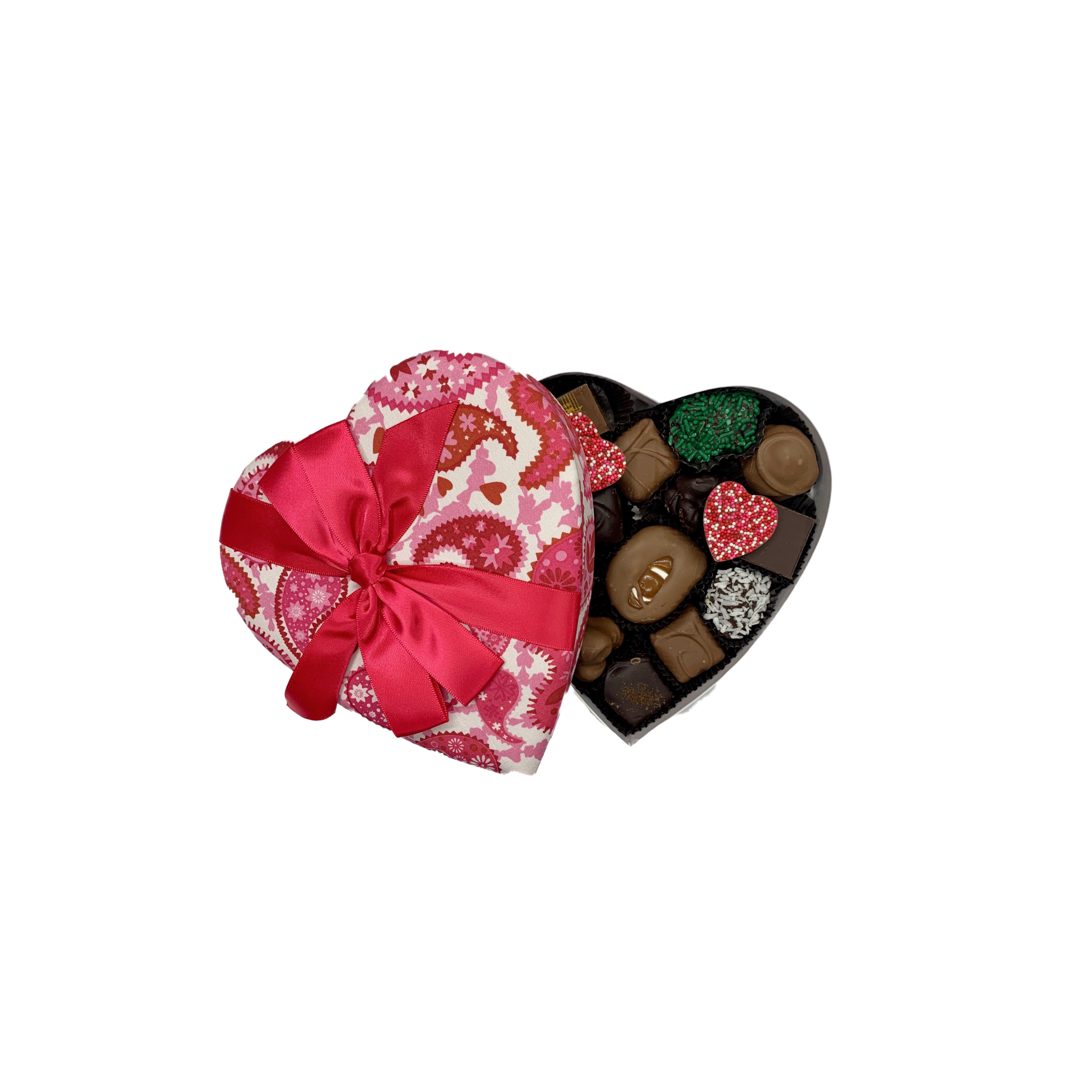 Heart-shaped box of chocolates with a decorative lid on a white background