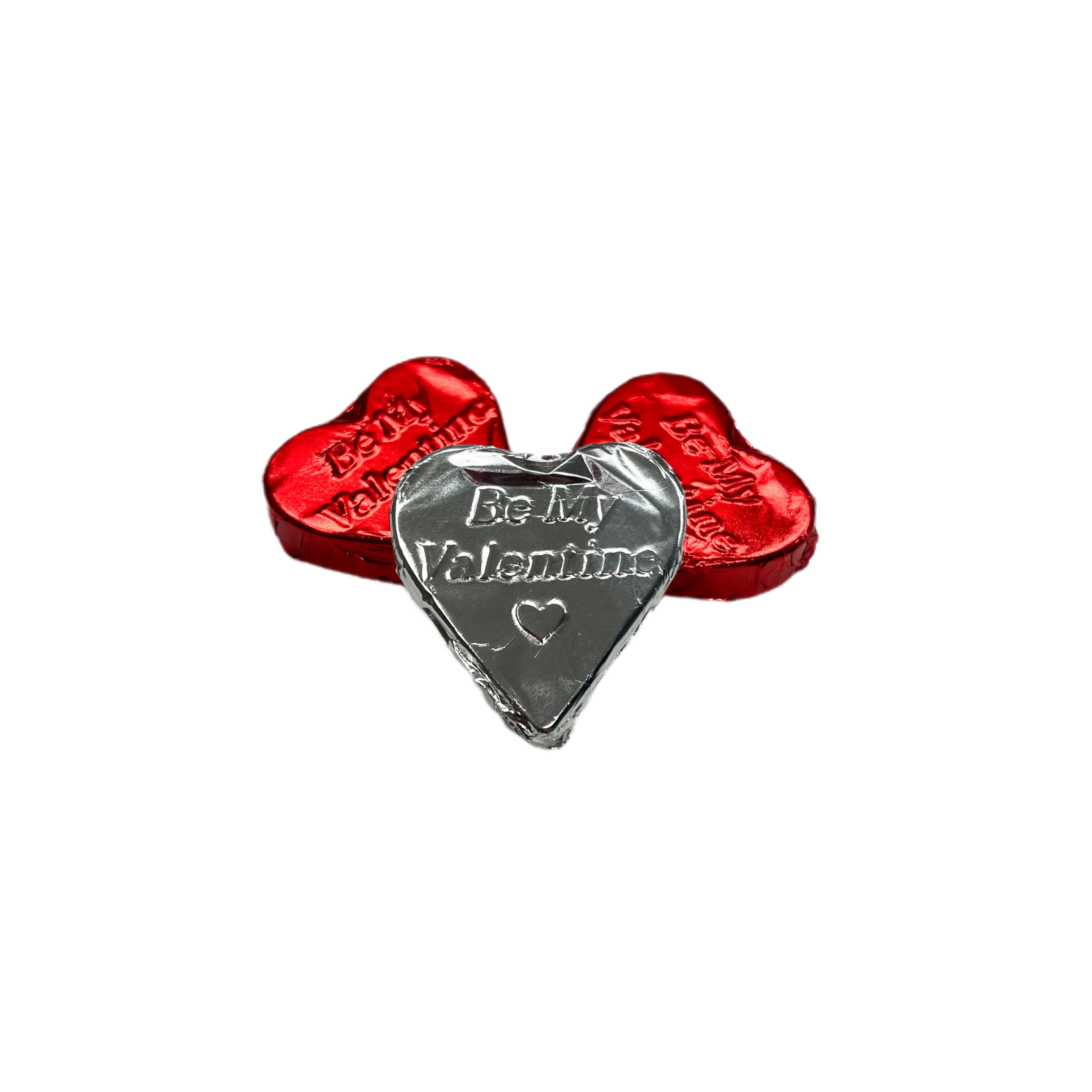Silver heart-shaped charm with 'Be My Valentine' text on a white background