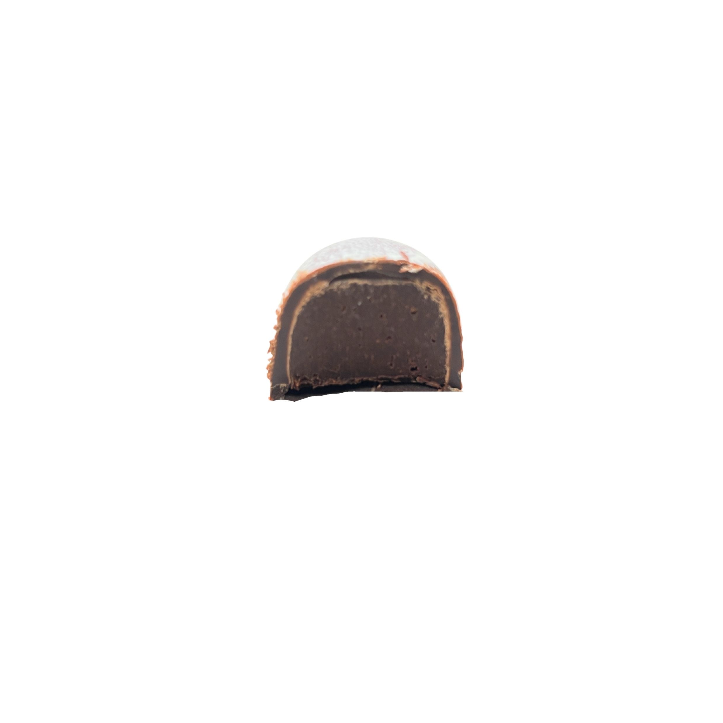 A single cut cross-section of a chocolate confection, showing a dark brown center and a lighter brown outer layer, isolated on a solid white background.