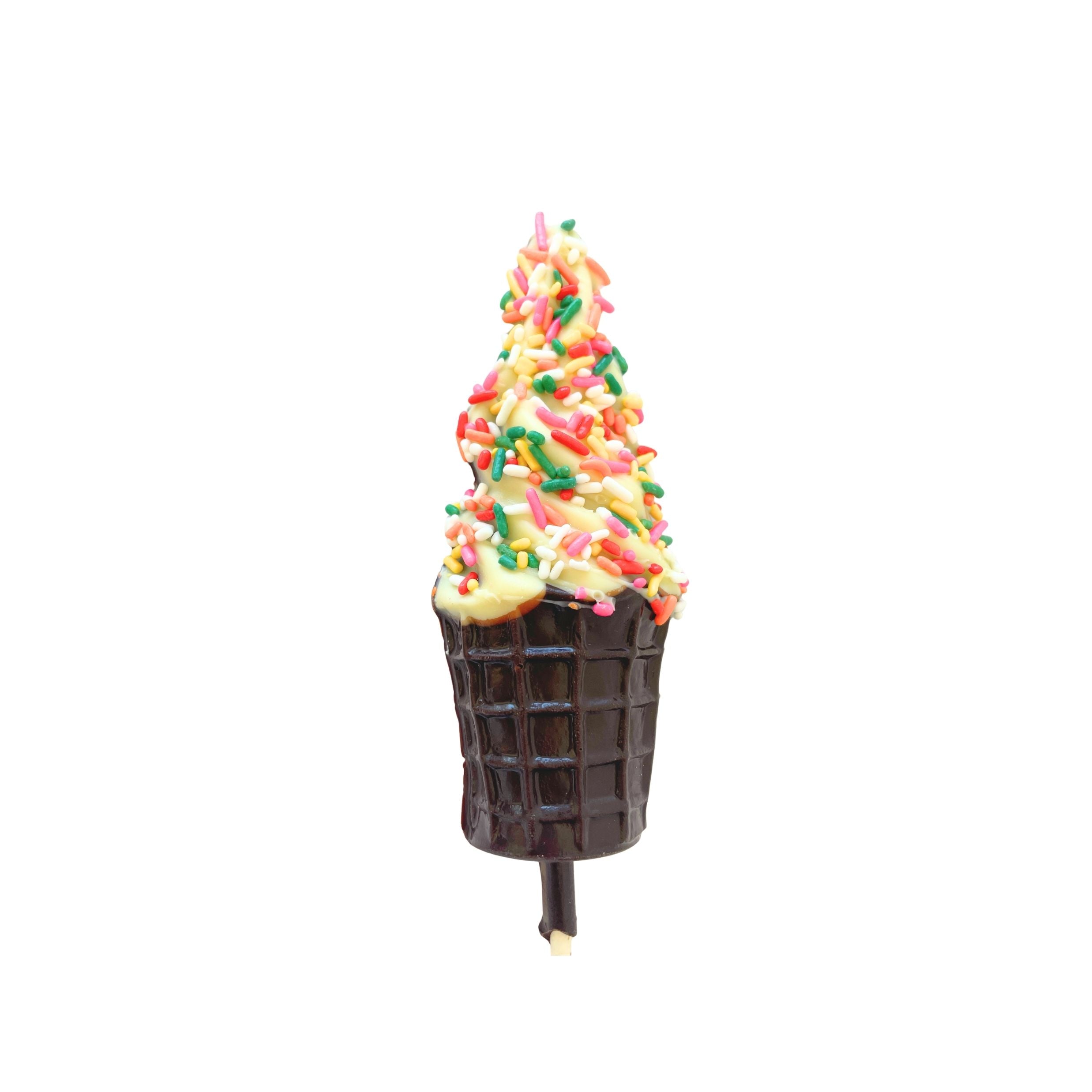 A chocolate ice cream cone on a stick, filled with soft-serve style chocolate and topped with colorful sprinkles, isolated on a white background.